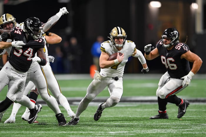 Nov 28, 2019; Atlanta, GA, USA; New Orleans Saints quarterback Taysom Hill (7) runs through the Atlanta Falcons defense for a touchdown during the first half at Mercedes-Benz Stadium. Mandatory Credit: D